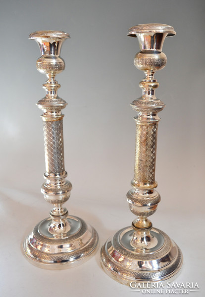 Silver pair of candlesticks with leaf decor