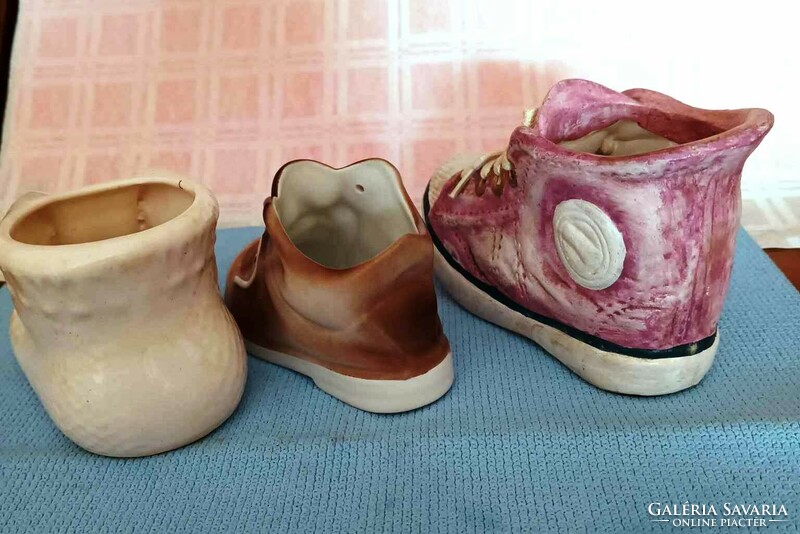 I am selling 3 small ceramic shoes