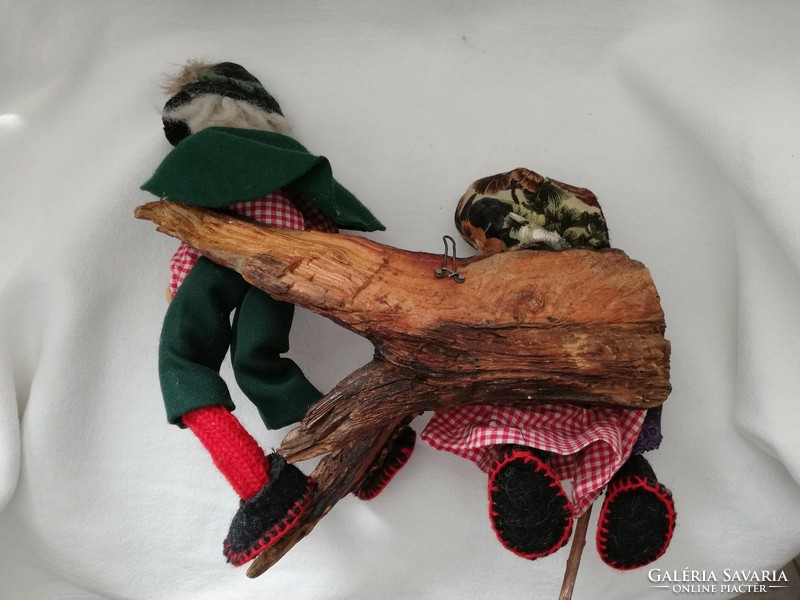 Handmade puppets of stepmother and stepmother resting on a tree branch, room decorations, decorations