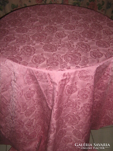 Beautiful vintage full of roses on damask tablecloth