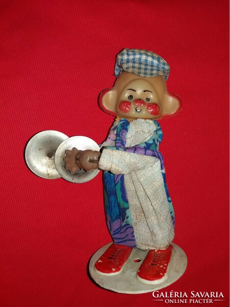 Old plastic clown toy figure with an old wooden body and a metal base, working cymbals, according to the pictures