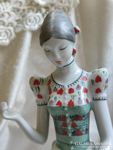 Hólloháza porcelain statue of a woman embroidering a knife / sewing girl in folk costume