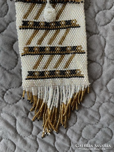 A neck phone case made with pearl weaving, a glasses holder, a small trinket