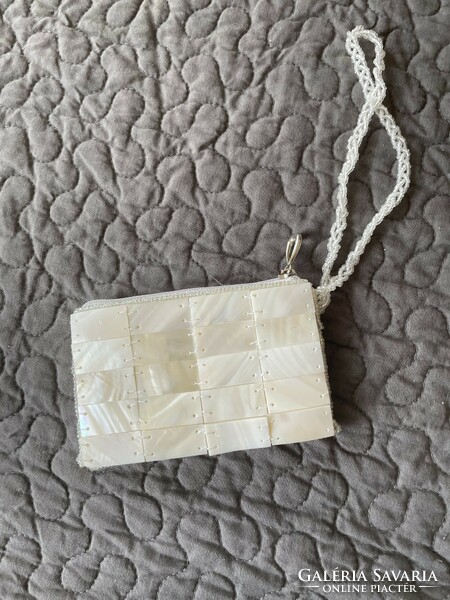 A small purse, handkerchief holder or wallet made of mother-of-pearl tiles