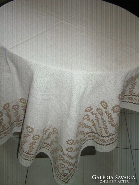 Beautiful vintage floral burst on white light brown woven tablecloth