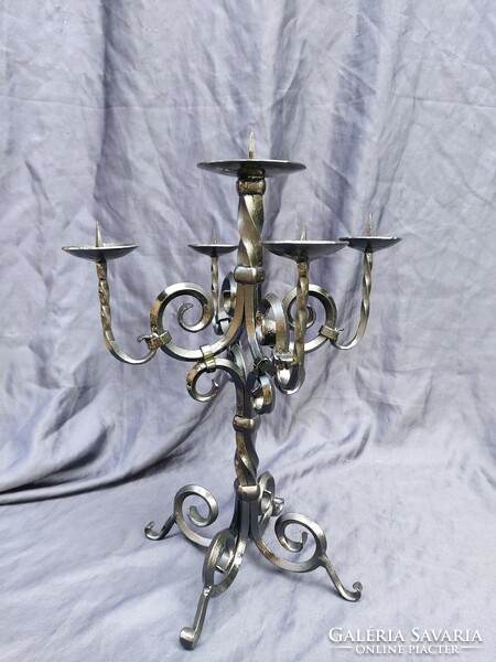 Wrought iron candle holder with 5 branches.