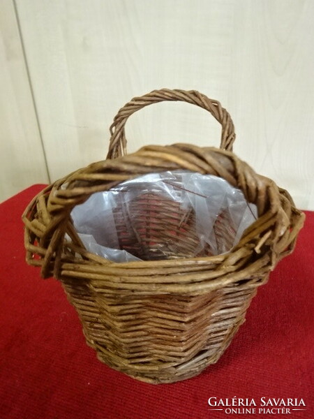 Cane basket, lined with plastic. Its height is 14 cm. Jokai.
