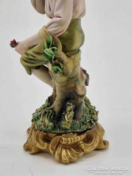 Capodimonte dreaming boy a figure on a log 18cm