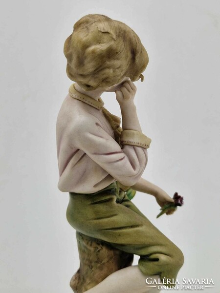 Capodimonte dreaming boy a figure on a log 18cm