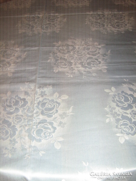 Beautiful vintage damask tablecloth with light blue rose pattern