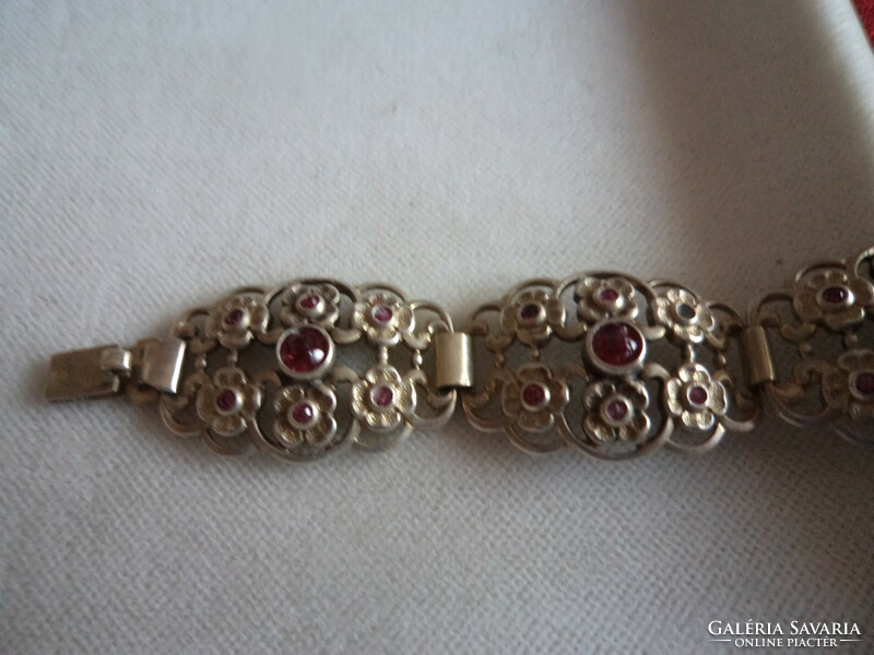 Beautiful gold-plated bracelet_ with small burgundy stones