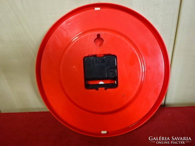 Red, plastic frame, quartz wall clock, diameter 24.5 cm. Jokai.