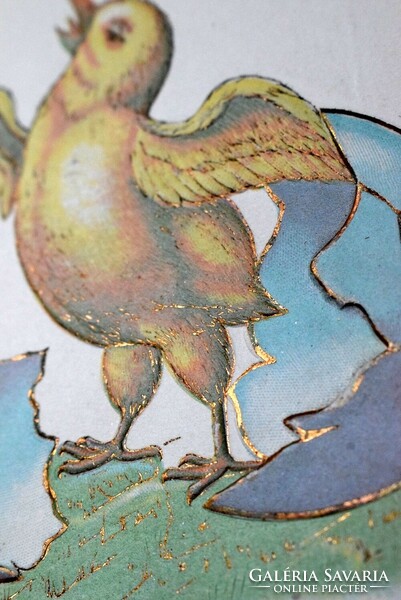 Antique embossed Easter greeting card chick hatching from an egg