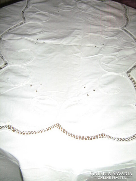 Beautiful ribbon embroidered on special white lace tablecloth