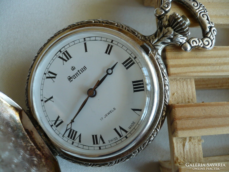 Santus is a beautifully decorated and very rare Swiss mechanical pocket watch with a hunting scene