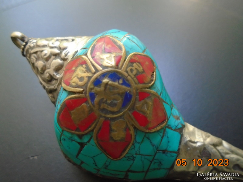 Tibetan talisman with silver and turquoise covering, applied bronze Buddhist symbols with coral and lapis stones