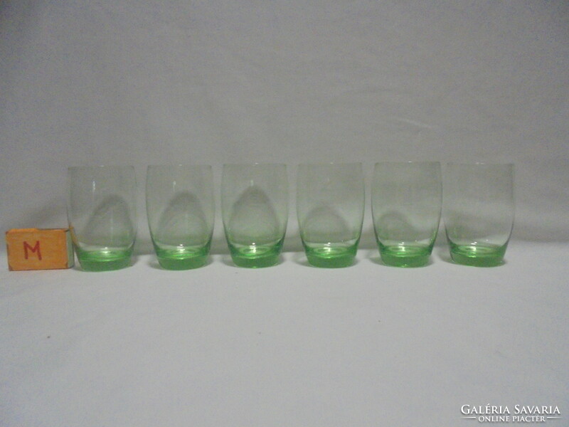 Six old, pale green water, wine or soda glasses together