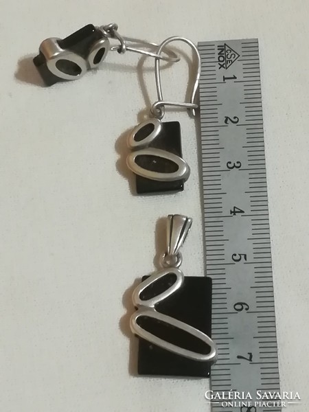 Silver earrings and pendant.