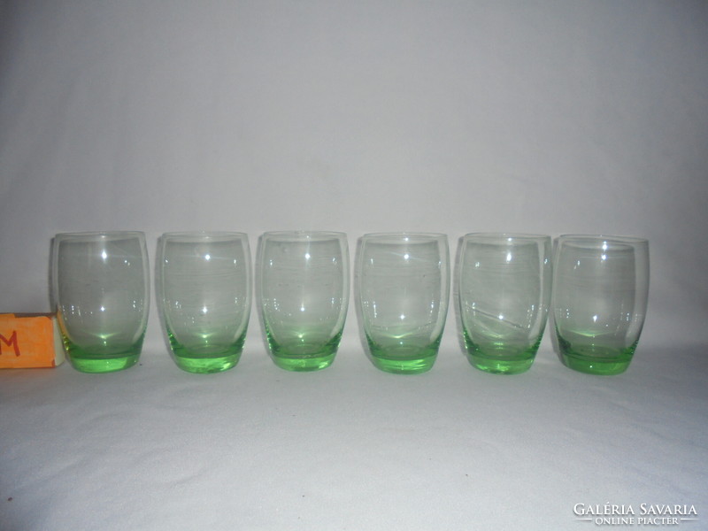 Six old, pale green water, wine or soda glasses together