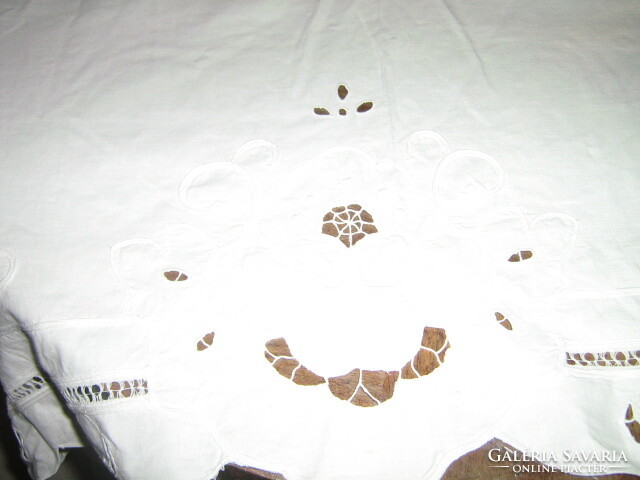 Beautiful ribbon embroidered on special white lace tablecloth