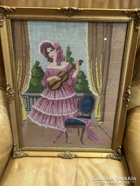 Girl with a violin - tapestry picture, handmade, in a graceful glazed, gilded picture frame.