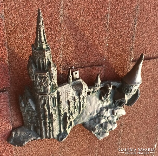 Antique bronze relief castle