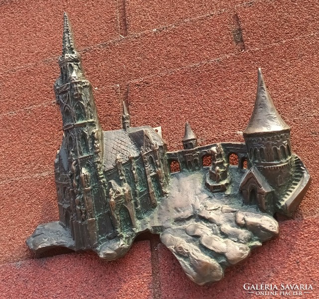 Antique bronze relief castle