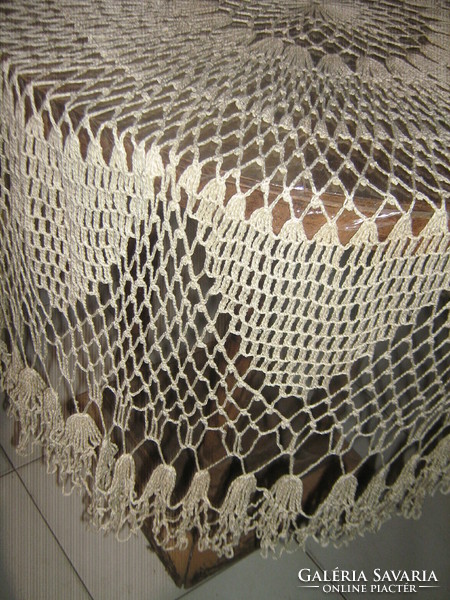 Beautiful ecru hand-crocheted round lace tablecloth