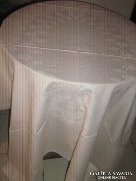 Beautiful elegant floral pattern on pale beige damask tablecloth tablecloth