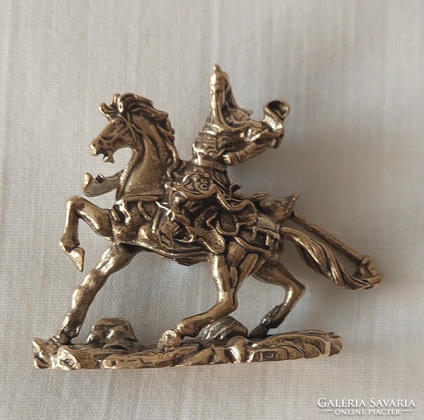 Miniature copper equestrian figure