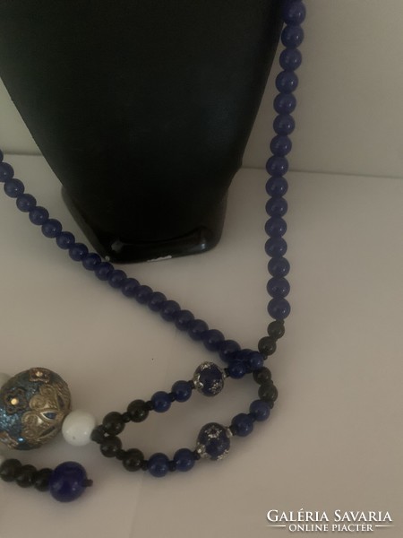 A string of beads made of painted glass beads with a lapis lazuli effect