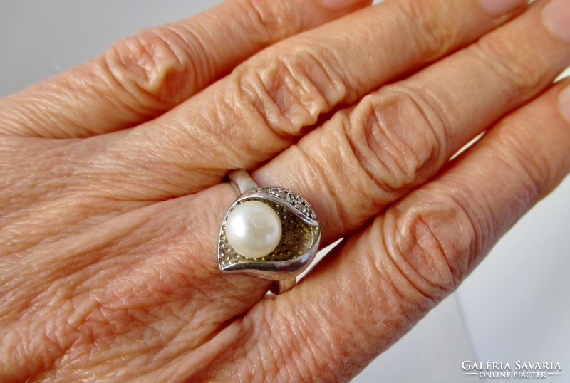 A beautiful sterling silver ring with genuine pearls