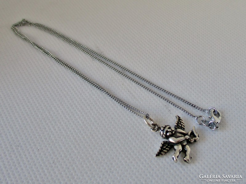 Old silver necklace with a beautiful little angel