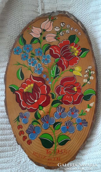 Wooden wall decoration with beautiful Hungarian folk motif painting.