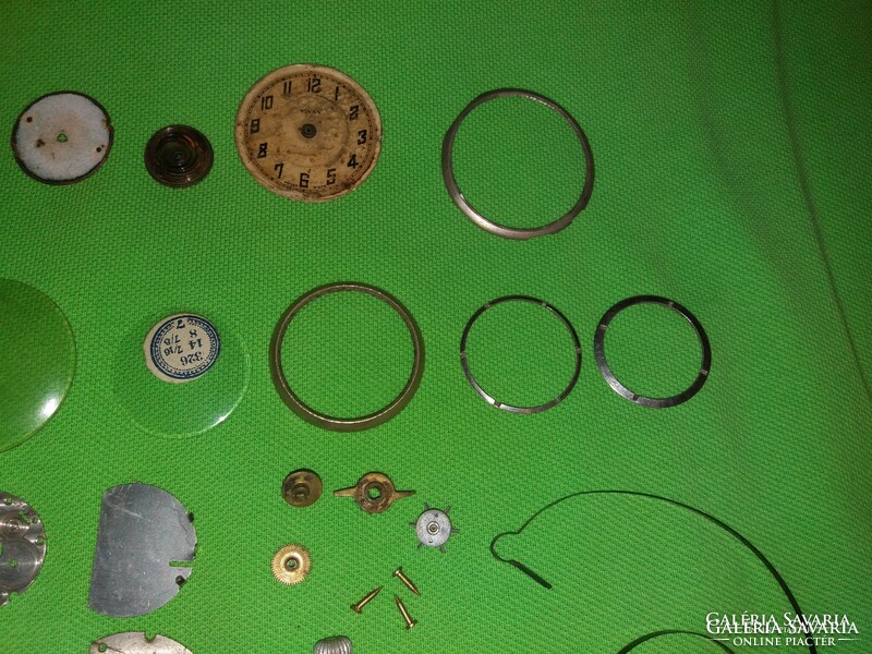 Huge clock parts package with antique old pieces only in one according to the pictures