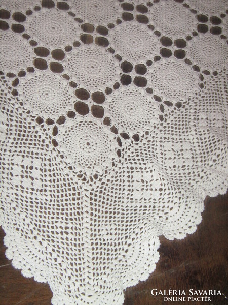 Beautiful white hand crocheted antique lace tablecloth with flower pattern