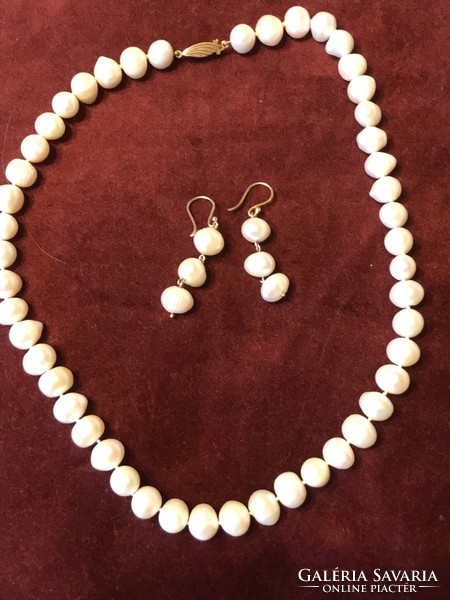 Cultured pearl string earrings with 14 carat gold fittings