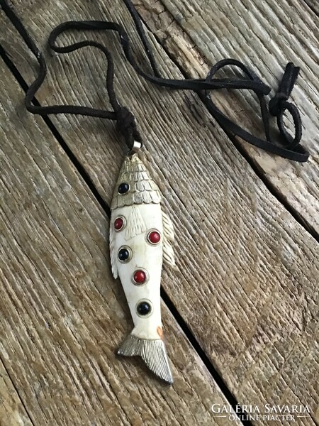 Old cartier style bone fish pendant on a leather necklace