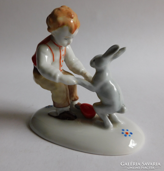 Metzler & Ortloff hand painted Easter figurine - boy with bunny and red egg