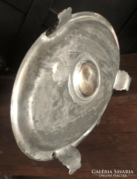 Old metal, adjustable candle holder