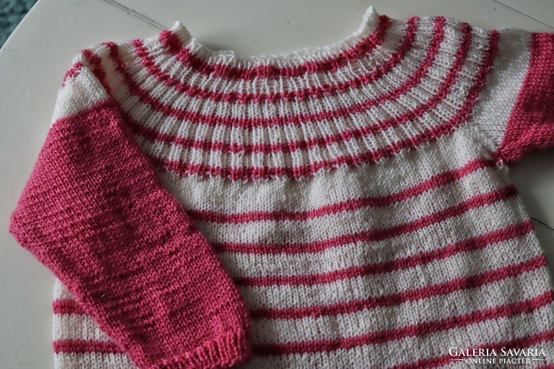 Hand-knitted baby girl sweater