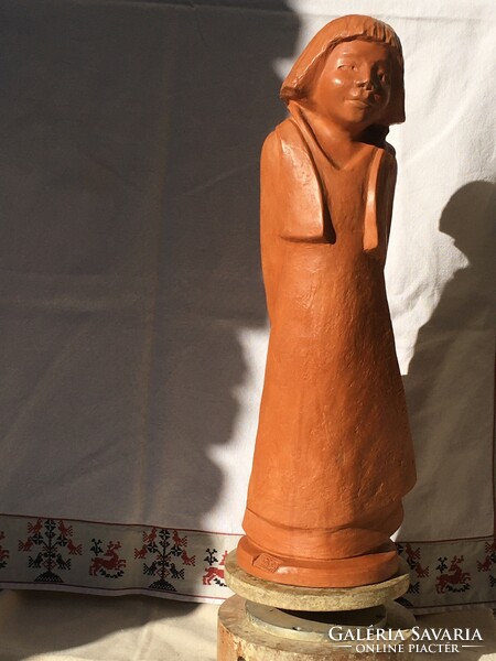 The girl, a large terracotta statue