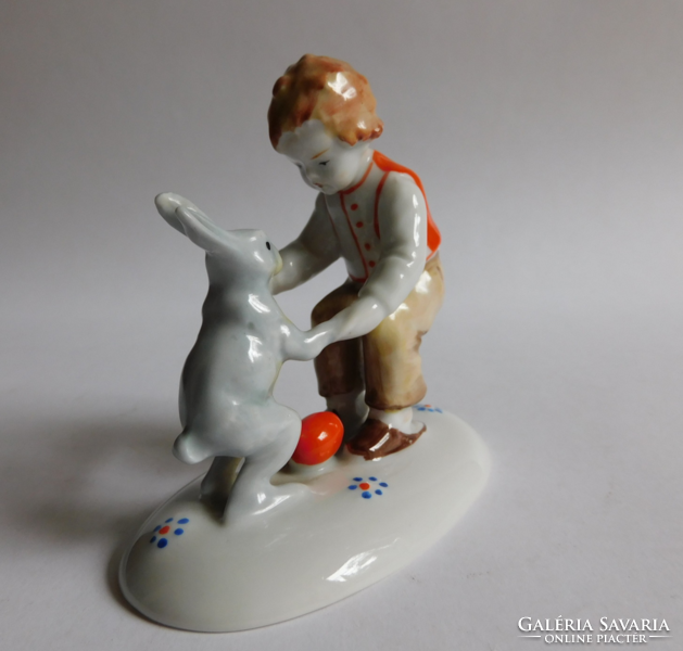 Metzler & Ortloff hand painted Easter figurine - boy with bunny and red egg