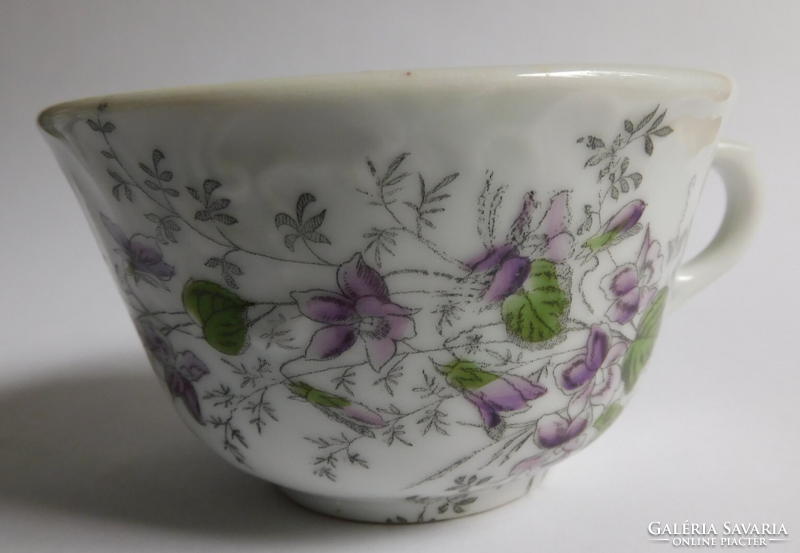 Antique, thick-walled tea cup with violet pattern