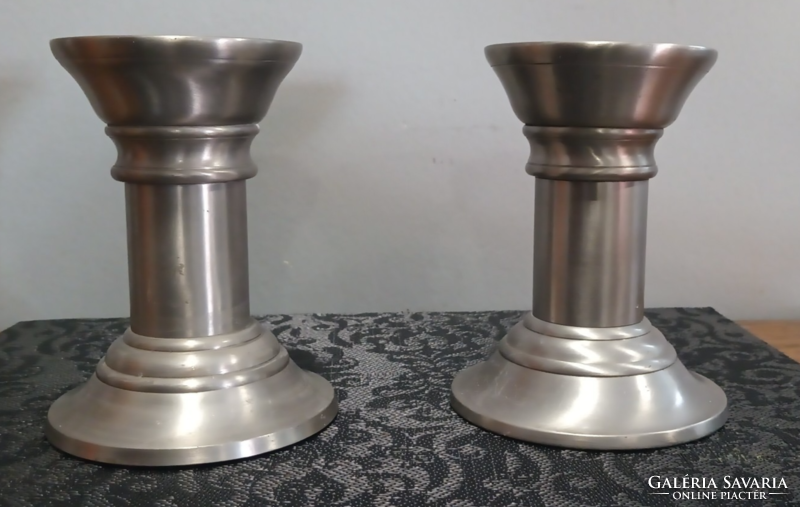 A pair of art-deco candle holders with a modern design can be negotiated