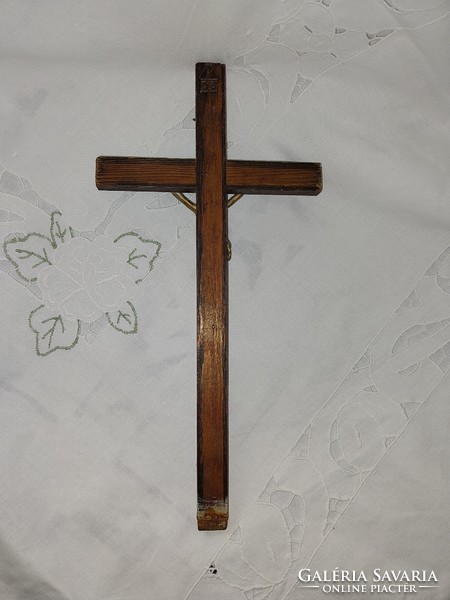 Old wooden cross with metal body