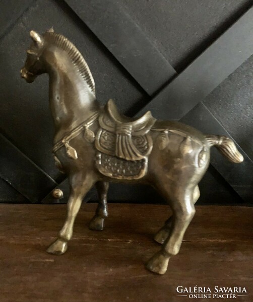 Metal horse statue with fine decoration