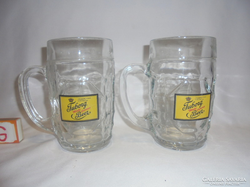 Two tuborg beer half-liter certified beer mugs together