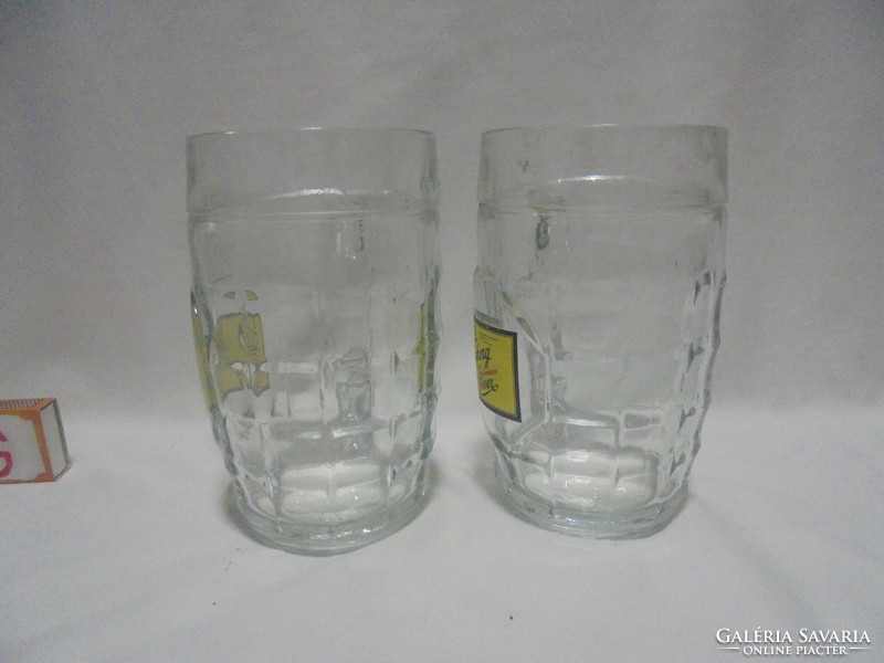 Two tuborg beer half-liter certified beer mugs together