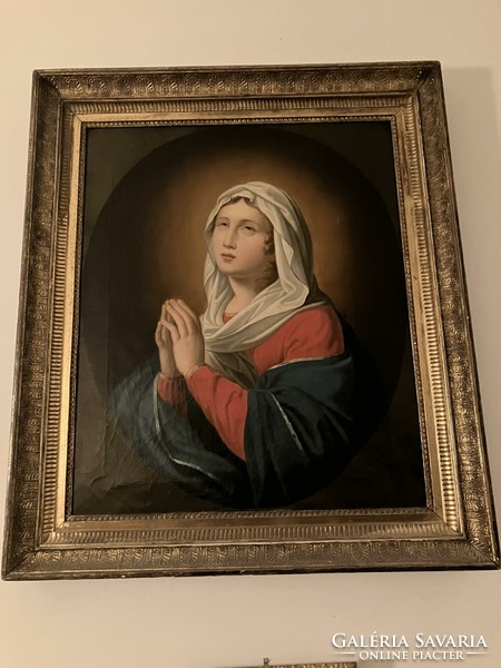 Antique oil painting depicting the Virgin Mary, in an ornate frame
